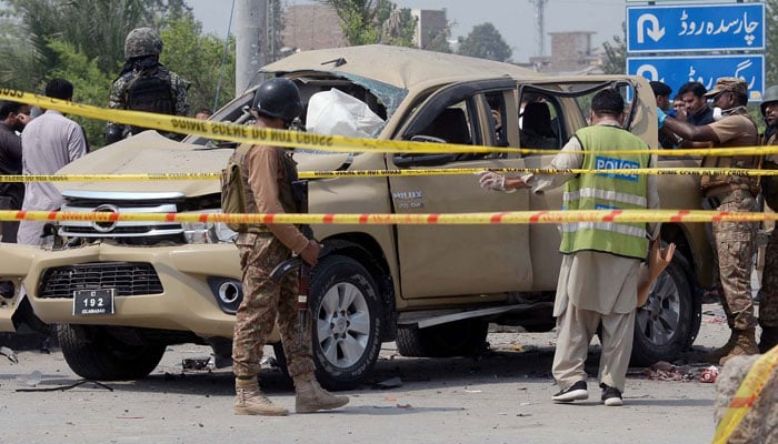 Security and rescue officials gather at the site after a bomb attack that targeted Frontier Corps (FC) vehicle, at Warsak road area in Peshawar on Monday, September 11, 2023. — PPI