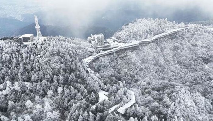 This photo taken on December 16, 2023 shows an aerial view of the Nanyue Hengshan Scenic Area after a snowfall in Hengyang, in Chinas central Hunan province. — AFP