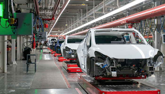 Cars are seen on the assembly line during a tour of the Tesla Giga Texas manufacturing facility ahead of the Cyber Rodeo grand opening party on April 7, 2022, in Austin. — AFP