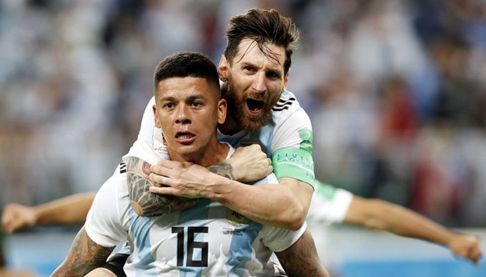 Marcos Rojo celebrates with teammate Lionel Messi. — X/@epa/@anatoly