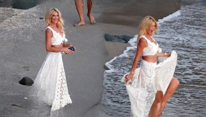 The Swedish model appeared to be in high spirits, playfully frolicking in the sea on Christmas Day
