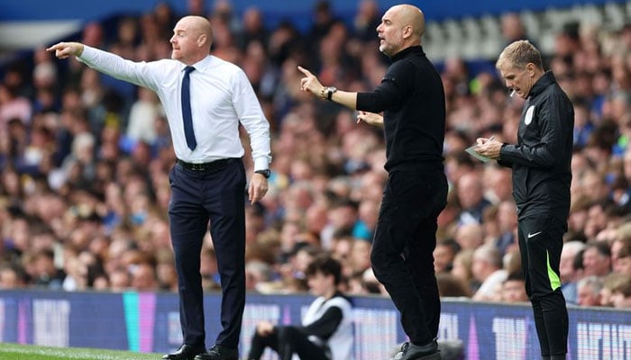 Everton manager Sean Dyche and Manchester City boss Pep Guardiola give instructions to their teams last season. — Manchester Evening News.