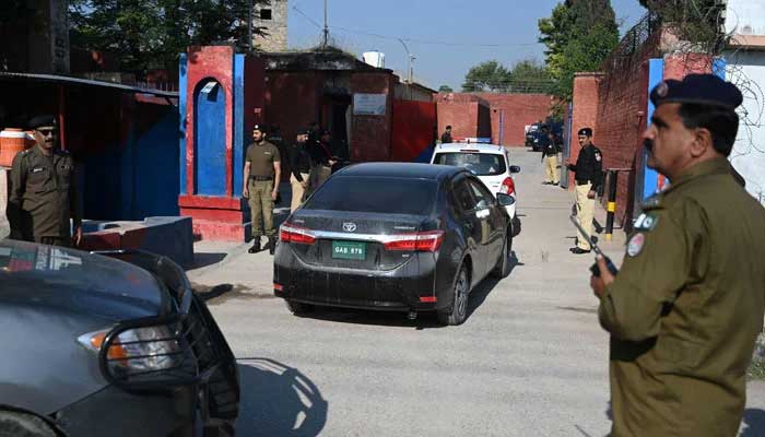 A convoy of vehicles carrying the special court judge Abual Hasnat Muhammad Zulqarnain, arrives at the Adiala Jail for the hearing of jailed former Pakistan prime minister Imran Khan, in Rawalpindi on October 23, 2023. — AFP