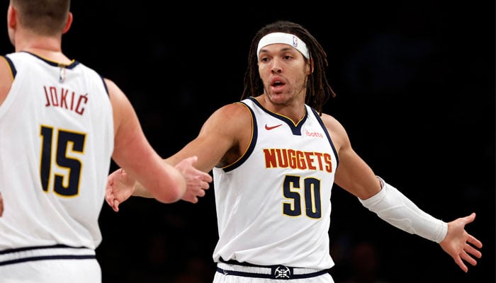 Aaron Gordon #50 reacts with Nikola Jokic #15 of the Denver Nuggets during the first half against the Brooklyn Nets at Barclays Center on December 22, 2023, in the Brooklyn borough of New York City. — AFP