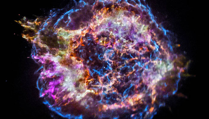 An illustration of a Supernova shining brightly in a galaxy. — Nasa