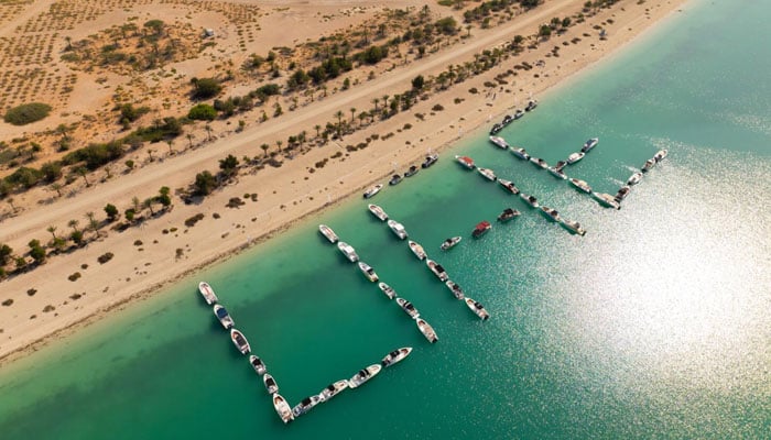 An aerial view of 52 boats docked at Al Lulu Island in Abu Dhabi for UAEs new record of creating the largest word. — Khaleej Times