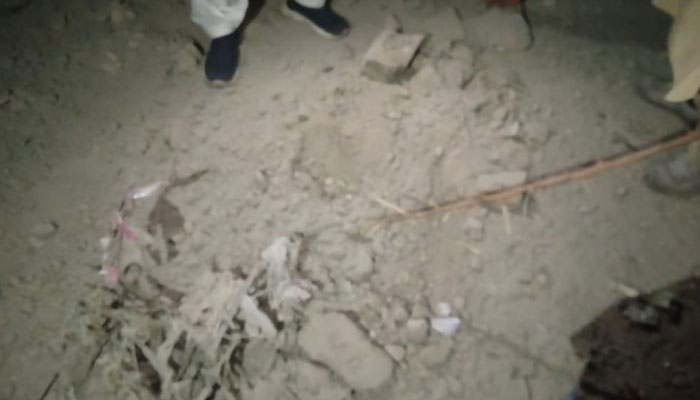 Policeman inspecting bomb explosion site in Balochistan’s Bolan district on December 30, 2023. — Reporter