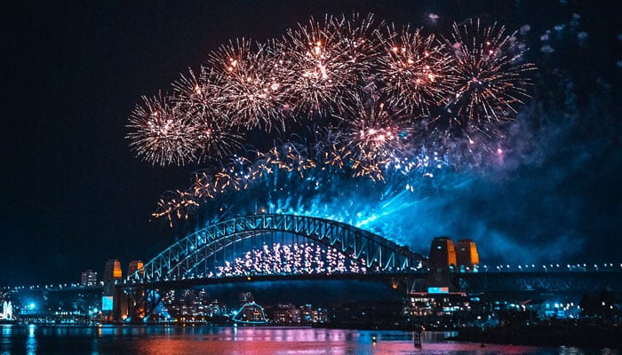 A representational image showing a display of fireworks over the Harbour Bridge in Sydney, Australia. — Unsplash