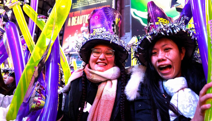 Revellers take part in celebrations ahead of the 2024 New Years Eve Ball drop in Times Square on December 31, 2023, in New York City.