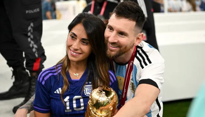 Lionel Messi and Antonela Roccuzzo celebrate after Argentinas triumph at the 2022 World Cup. — X/@getty