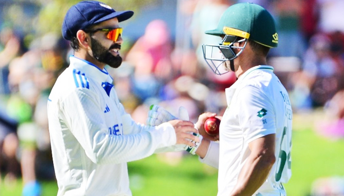 India’s Virat Kohli (left) and South Africa’s Dean Elgar during day one of the Test between India and South Africa in Cape Town, South Africa, on January 3, 2024. — X/@ProteasMenCSA