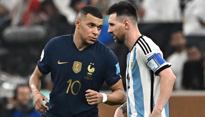 French forward Kylian Mbappe (left) and Argentina’s Lionel Messi talk during a match. — AFP/File