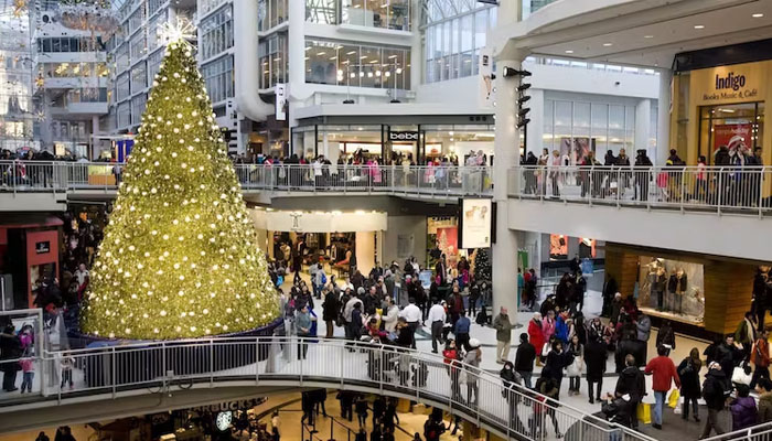People wind their way through the Eaton Centre in Toronto during the December holidays. — X/2thecanadianpress