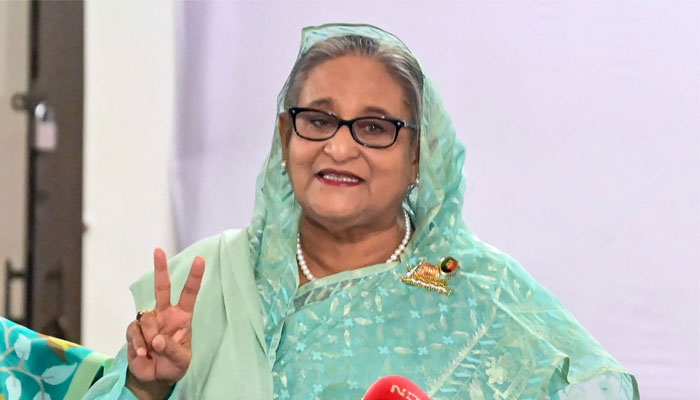 Bangladeshs Prime Minister Sheikh Hasina gestures after casting her vote casts at a polling station in Dhaka on January 7, 2024. — AFP