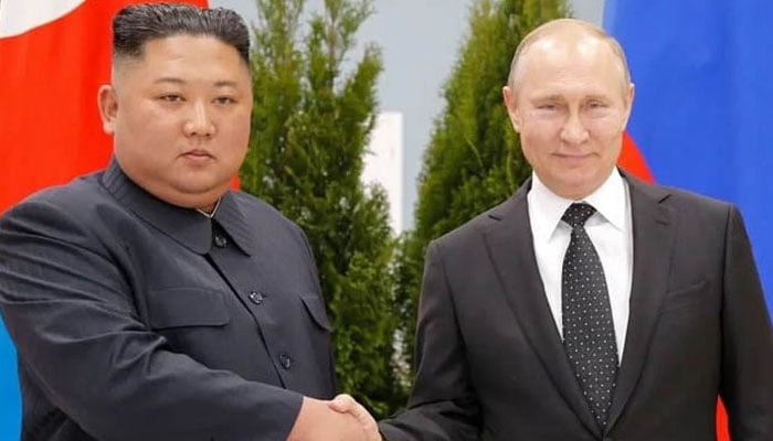Vladimir Putin with Kim Jong Un. — AFP/File