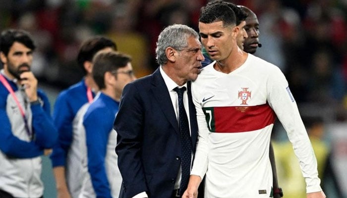 Portugal’s coach Fernando Santos (left) greets Cristiano Ronaldo as he leaves the pitch during their 2022 World Cup Group H match against South Korea at the Education City Stadium in Al-Rayyan, Qatar. — AFP/File
