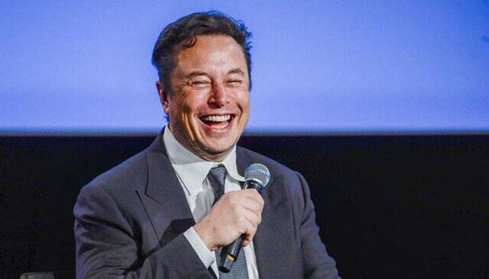 Tesla CEO Elon Musk smiles as he addresses guests at the Offshore Northern Seas 2022 (ONS) meeting in Stavanger, Norway, on August 29, 2022. — AFP