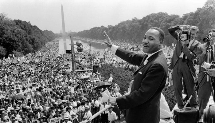 US civil rights leader Dr. Martin Luther King Jr waves to supporters on August 28, 1963, on the Mall in Washington DC during the March on Washington, where King delivered his famous I Have a Dream speech. —AFP