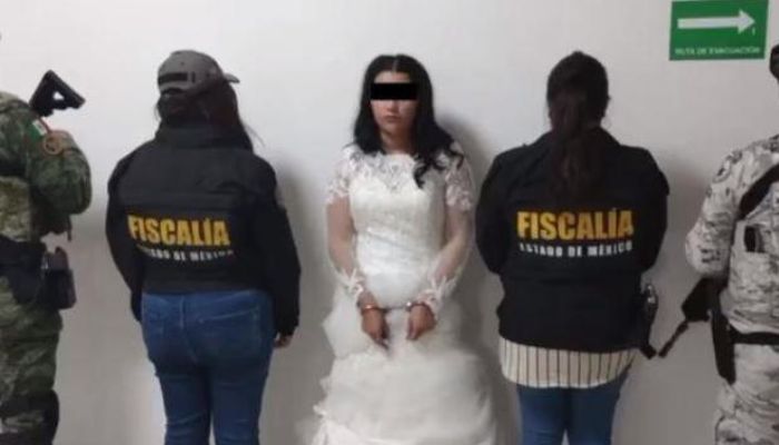 The Mexico state prosecutors office posted an image showing Nancy N in handcuffs, still wearing her wedding dress. — Mexico State Attorney Generals Office