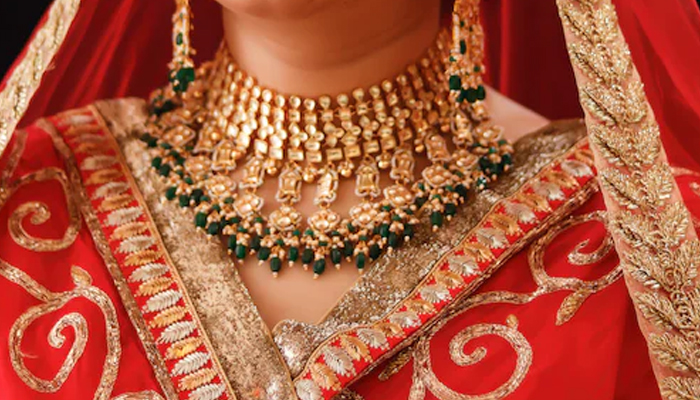 Representational image of a bride wearing jewellery. — Unsplash