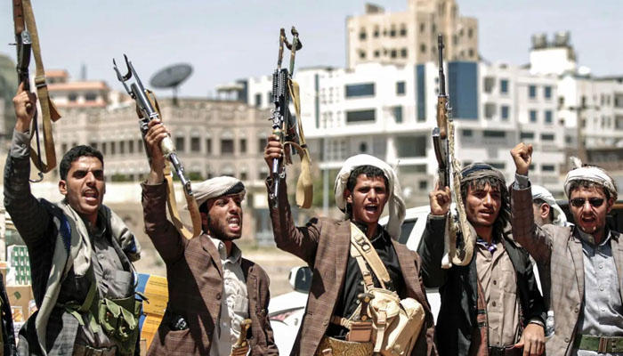 Yemens Iran-backed Houthi rebels pointing weapons towards the sky. — AFP/File