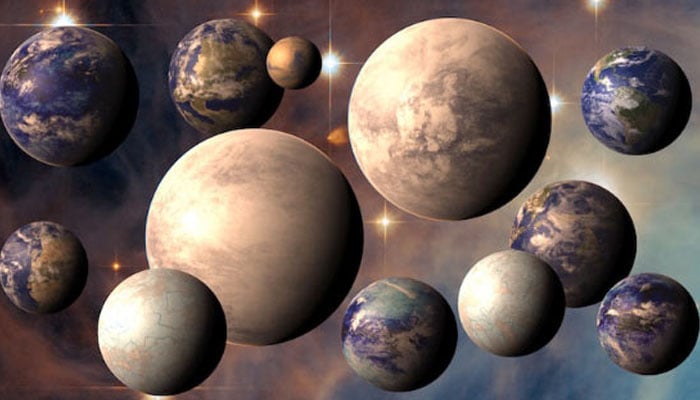 An artist’s rendering of potentially habitable exoplanets, plus Earth (top right) and Mars (top centre). — Nasa/File