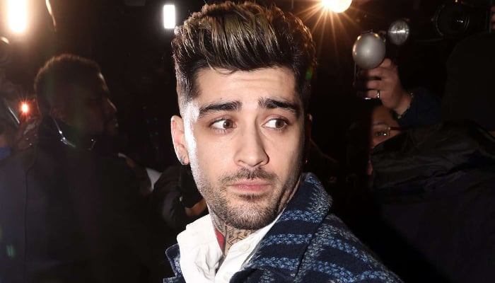 Zayn Malik brushes off fan concerns after foot is run over by car in Paris