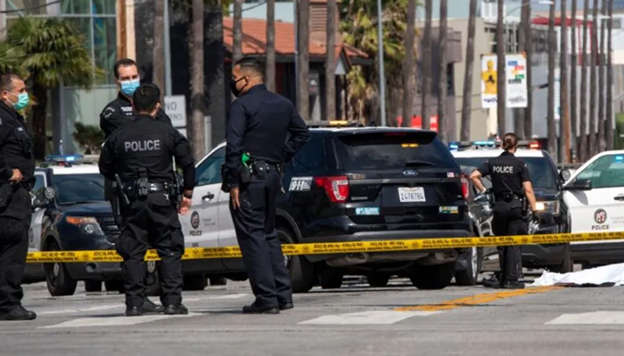Los Angeles Police officials can be seen outside a crime scene. — AFP/File
