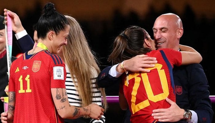Spains defender Rocio Galvez is congratulated by President of the Royal Spanish Football Federation Luis Rubiales next to Jennifer Hermoso after winning the Australia and New Zealand 2023 Womens World Cup final between against England in Sydney on Aug 20, 2023. — AFP