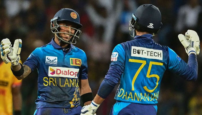 Sri Lanka’s Pathum Nissanka and Dhananjaya de Silva (right) celebrate after winning the third and final Twenty20 international cricket match between Sri Lanka and Zimbabwe at the R. Premadasa Stadium in Colombo on January 18, 2024. — AFP
