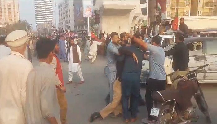 The picture shows PTI workers clashing with police in Karachi on January 28, 2024. — X/@KarachiPolice_