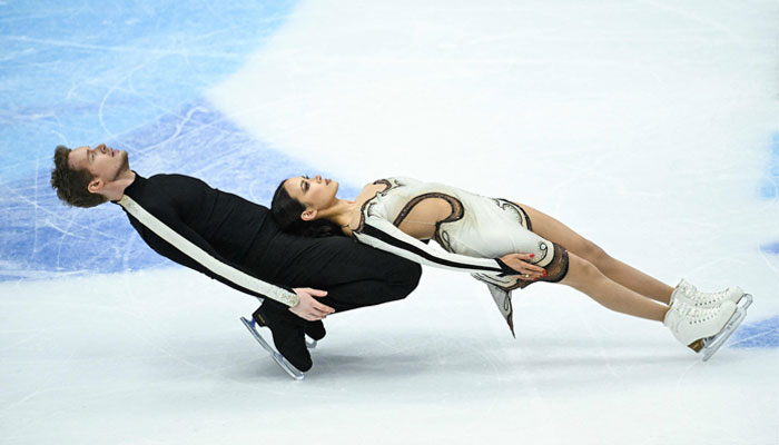 USA´s Madison Chock (R) and Evan Bates compete in the ice dance free skating event during the ISU Grand Prix of Figure Skating Final in Beijing on December 9, 2023. — AFP