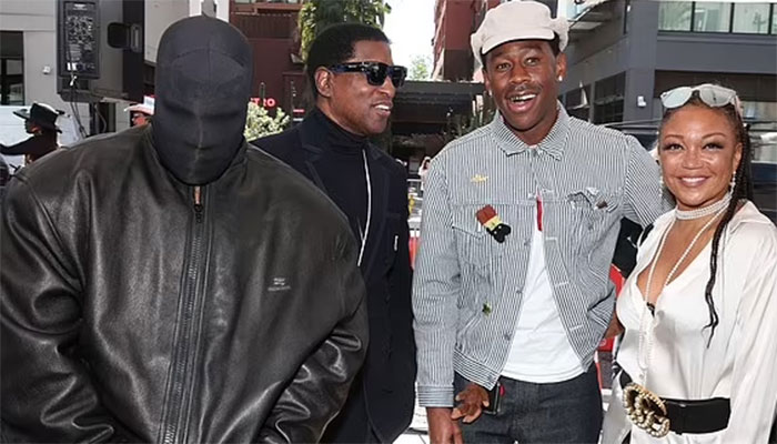 Kanye Wests enigmatic black face at Charlie Wilsons Walk of Fame Induction.