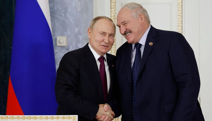 This photograph shows Russias President Vladimir Putin and Belarus President Alexander Lukashenko attending a meeting of the Supreme State Council of the Union State of Russia and Belarus, in Saint Petersburg on January 29, 2024. — AFP