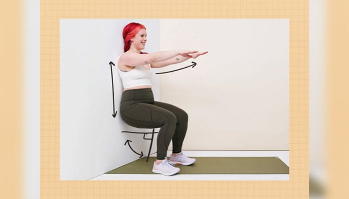 Image of a woman performing a wall sit. — Sit