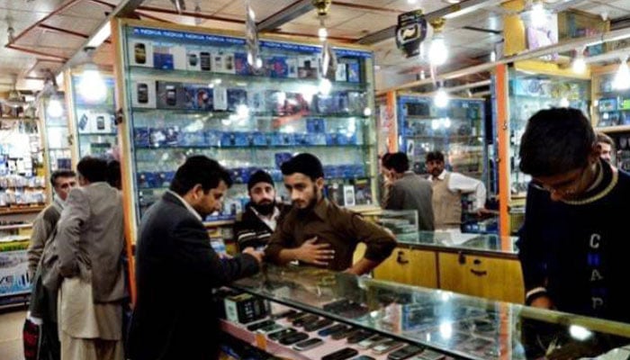 A representational image of a mobile shop in Pakistan. — AFP/File