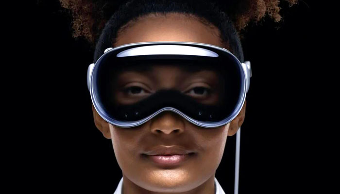 Apples Vision Pro headset worn by a person. — Apple