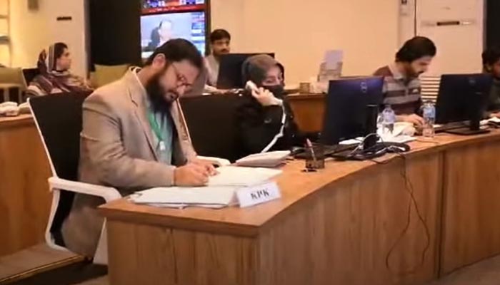 ECP officers can be seen overseeing the operations of the Election Monitoring Control Centre in this photo taken from a video. — YouTube/@ElectionCommissionofPakistan
