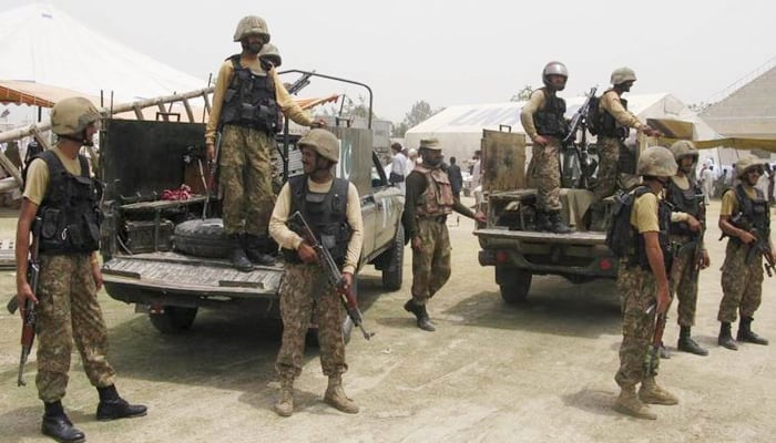 Pakistani soldiers stand guard in Bannu, Khyber-Pakhtunkhwa July 2, 2014. — AFP