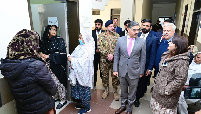 Caretaker Prime Minister Anwaar-ul-Haq Kakar visits various polling stations for the general elections 2024 in Islamabad and Rawalpindi on February 8, 2024. — APP