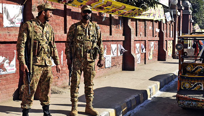 Pakistan Army soldiers stand alert outside a polling station during the elections in Lahore, on February 8, 2024. — Online