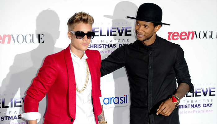 Usher engages in talks with former protege Justin Bieber for Super Bowl Halftime surprise.