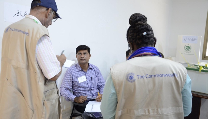 A Commonwealth Group team interviewing a polling officer in Pakistan. —thecommonwealth.org