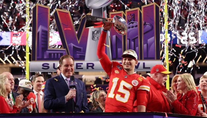 Star quarterback for the Kansas City Chiefs, Patrick Mahomes, lifting the Vince Lombardi Trophy. — Sporting News/File
