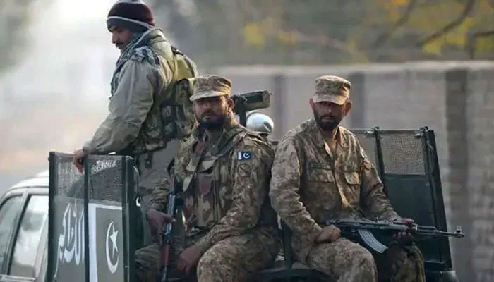 In this undated photo, Pakistan Army soldiers ride on a vehicle. — AFP