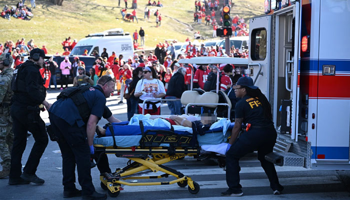 An injured person is loaded on an ambulance near the Kansas City Chiefs Super Bowl LVIII victory parade, on Feb. 14, 2024, in Kansas City, Missouri. Shots were reportedly fired during the parade, according to police. — AFP