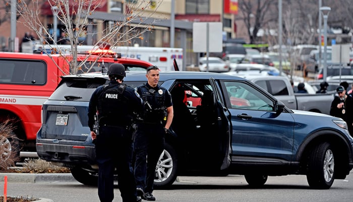 Officials of Colorado Police stand near the crime scene. — AFP/File