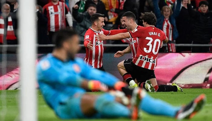 Athletic Bilbaos Alex Berenguer (L) celebrates with teammates after scoring his teams second goal against Girona at the San Mames stadium in Bilbao. - AFP