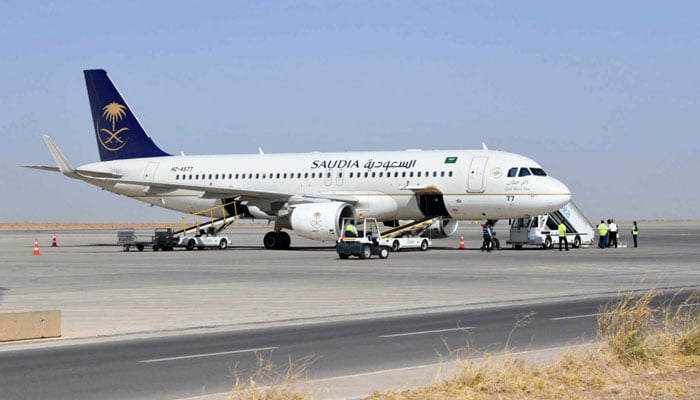 A Saudi Airline aircraft is seen parked at an airport. — AFP/File