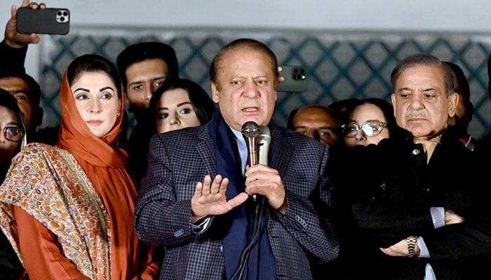 PML-N supremo Nawaz Sharif along with his brother, Shehbaz Sharif, and his daughter, Maryam Nawaz, speaks with supporters at Model Town on February 9, 2024. — APP